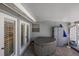 Covered patio features a hot tub, offering a private space to relax near the pool area at 2723 59Th St, Sarasota, FL 34243