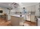 Well-lit kitchen featuring stainless steel appliances and a central island at 2723 59Th St, Sarasota, FL 34243