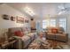 Bright living area features comfortable seating, stylish décor, and easy access to outdoor spaces at 2723 59Th St, Sarasota, FL 34243
