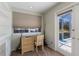 Bright office featuring a natural-wood desk, window, and a view to the outside through a glass door at 2723 59Th St, Sarasota, FL 34243