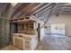 Interior view of the workshop space showing the kitchenette, workbench and exposed beams at 2723 59Th St, Sarasota, FL 34243