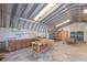 Interior view of the metal workshop with exposed beam ceiling and concrete flooring at 2723 59Th St, Sarasota, FL 34243