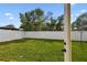 View of the large, fenced backyard with fresh green lawn at 3113 W Nassau St, Tampa, FL 33607