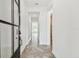Hallway with herringbone pattern floors leading to living spaces at 3113 W Nassau St, Tampa, FL 33607