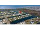 Beautiful aerial view of waterfront homes on canals with ocean access and lush surrounding landscape at 3416 Crape Myrtle Dr, Hernando Beach, FL 34607
