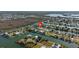 Scenic aerial shot of waterfront community with easy canal access amidst natural greenery and waterways at 3416 Crape Myrtle Dr, Hernando Beach, FL 34607