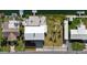 Aerial shot showcasing a well-maintained home, spacious backyard, and dock access to the serene canal at 3416 Crape Myrtle Dr, Hernando Beach, FL 34607