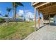 Spacious backyard with wooden deck and direct access to the canal waterway, perfect for outdoor entertaining at 3416 Crape Myrtle Dr, Hernando Beach, FL 34607