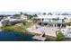 Beautiful waterfront backyard featuring a patio with a firepit, and a dock on the canal at 3416 Crape Myrtle Dr, Hernando Beach, FL 34607