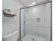 Contemporary bathroom with a glass-enclosed shower and stylish tile work at 3416 Crape Myrtle Dr, Hernando Beach, FL 34607
