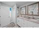 Beautiful bathroom with dual sinks, marble countertops, and updated fixtures at 3416 Crape Myrtle Dr, Hernando Beach, FL 34607