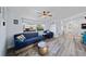 Inviting living room with comfortable seating, natural light, and wood-look floors at 3416 Crape Myrtle Dr, Hernando Beach, FL 34607