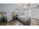 Serene primary bedroom featuring soft colors and access to the ensuite bathroom at 3416 Crape Myrtle Dr, Hernando Beach, FL 34607