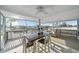 Enclosed porch offers panoramic water views, a ceiling fan, and plenty of space for outdoor enjoyment at 3416 Crape Myrtle Dr, Hernando Beach, FL 34607