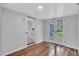 Bright room featuring wood floors, white walls and glass doors overlooking the backyard at 3608 Water St, Ellenton, FL 34222