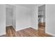 Empty room featuring wood floors and a door opening up to the kitchen at 3608 Water St, Ellenton, FL 34222