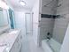 Bright bathroom with tile flooring, walk-in shower, and granite vanity at 3744 Lake Bayshore Dr # K-503, Bradenton, FL 34205