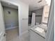 Bathroom featuring a walk-in shower, neutral tile, granite counter and built-in shelves at 3744 Lake Bayshore Dr # K-503, Bradenton, FL 34205