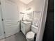 Updated bathroom with granite vanity and well-lit mirror, with dark shower surround at 3744 Lake Bayshore Dr # K-503, Bradenton, FL 34205