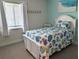 Comfortable bedroom with large window, white trim and furniture, and relaxing decor at 3744 Lake Bayshore Dr # K-503, Bradenton, FL 34205