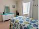 Cozy bedroom featuring a bright dresser and nautical-themed decor for a beachy feel at 3744 Lake Bayshore Dr # K-503, Bradenton, FL 34205