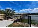 Scenic community dock with lake views and seating, perfect for relaxing and enjoying the waterfront at 3744 Lake Bayshore Dr # K-503, Bradenton, FL 34205