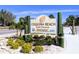 Welcome to Coquina Beach's South Entrance, featuring lush landscaping and clear signage at 3744 Lake Bayshore Dr # K-503, Bradenton, FL 34205
