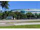 View of Manatee Memorial Hospital with palm trees and signage on a sunny day at 3744 Lake Bayshore Dr # K-503, Bradenton, FL 34205