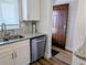 Well-lit kitchen featuring new appliances, granite countertops, a tiled backsplash, and a stainless steel sink at 3744 Lake Bayshore Dr # K-503, Bradenton, FL 34205