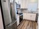 This gorgeous kitchen features stainless steel appliances, granite countertops, and a stylish tile backsplash at 3744 Lake Bayshore Dr # K-503, Bradenton, FL 34205