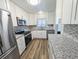 An open-concept kitchen provides plentiful counter space, modern stainless-steel appliances and sleek updated cabinetry at 3744 Lake Bayshore Dr # K-503, Bradenton, FL 34205