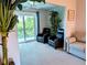 A living room with comfortable seating, a balcony view, and stylish decor, creating a relaxing and inviting space at 3744 Lake Bayshore Dr # K-503, Bradenton, FL 34205