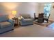 A living area showcasing comfortable seating, a dining set, and a warm, inviting atmosphere, perfect for relaxation at 3744 Lake Bayshore Dr # K-503, Bradenton, FL 34205