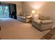 A spacious living room with plush seating, a large window, and a serene ambiance, creating a welcoming environment at 3744 Lake Bayshore Dr # K-503, Bradenton, FL 34205