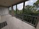 Spacious patio with tiled flooring, screened enclosure, and views of natural surroundings at 3744 Lake Bayshore Dr # K-503, Bradenton, FL 34205