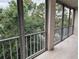 Screened lanai with tile flooring features views of lush greenery and a treed canopy at 3744 Lake Bayshore Dr # K-503, Bradenton, FL 34205
