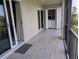 Tiled porch featuring a washer and dryer laundry area for added convenience at 3744 Lake Bayshore Dr # K-503, Bradenton, FL 34205