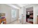 Neutral bathroom with marble floors, white toilet and view into main bedroom through an open door at 3761 Countryside Rd, Sarasota, FL 34233