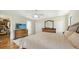 Neutral bedroom with ceiling fan, two dressers, a walk in closet, and wood flooring at 3761 Countryside Rd, Sarasota, FL 34233