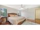Bedroom featuring hardwood floors, a ceiling fan, and two bedside tables at 3761 Countryside Rd, Sarasota, FL 34233