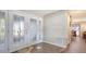 Bright foyer with decorative front door and tile flooring at 3761 Countryside Rd, Sarasota, FL 34233