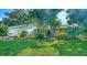 Charming home with mature landscaping and a well-manicured lawn at 3761 Countryside Rd, Sarasota, FL 34233