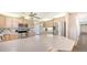 Spacious kitchen featuring stainless appliances, custom cabinets, and breakfast bar at 3761 Countryside Rd, Sarasota, FL 34233