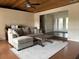 Comfortable living room featuring wood ceilings, neutral tones, and lots of natural light at 3761 Countryside Rd, Sarasota, FL 34233