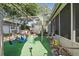 Backyard featuring playground set with swings, slide, and plenty of space for fun at 3941 Pin Oaks St, Sarasota, FL 34232