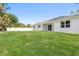 Spacious backyard features a well-maintained lawn and white fence at 4008 Antelope Ter, North Port, FL 34286