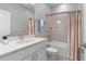 Well-lit bathroom with a shower-tub combo and quartz vanity at 4008 Antelope Ter, North Port, FL 34286