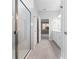 Modern bathroom with sleek glass shower, neutral tile and bright lighting with walk thru to vanity at 4008 Antelope Ter, North Port, FL 34286
