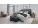 Stylishly designed bedroom featuring a comfortable bed, accent chair, and modern decor at 4008 Antelope Ter, North Port, FL 34286
