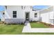 Close-up of a home's front entrance, showcasing stone accents, and a well-manicured lawn at 4008 Antelope Ter, North Port, FL 34286